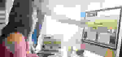 Man en vrouw werken samen achter een desktopscherm aan het maken van een zakelijke website